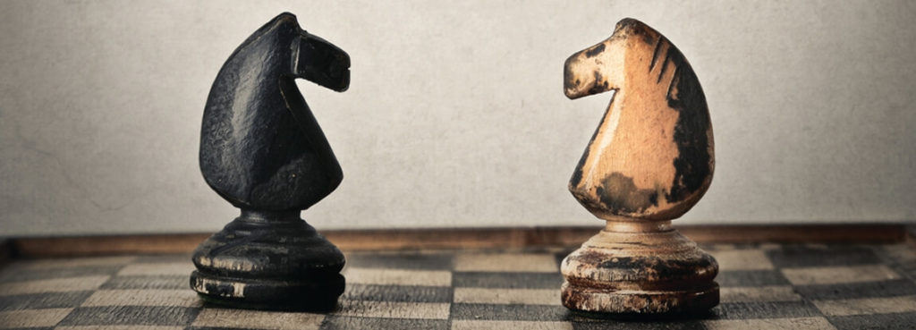 Two chess pieces on a chess board